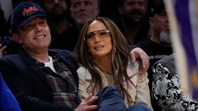 Ben Affleck and Jennifer Lopez watch the first half of an NBA basketball game between the Golden State Warriors and the Los Angeles Lakers in Los Angeles, Saturday, March 16, 2024. (AP Photo/Ashley Landis) (AP)