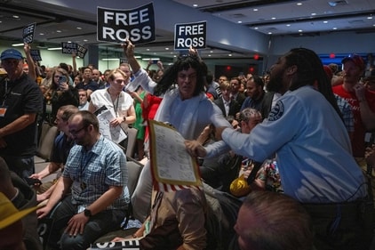 Security personnel grab a Libertarian party member shouting protests as former US President and Republican presidential candidate Donald Trump addresses the Libertarian National Convention in Washington, DC, May 25, 2024. (Photo by Jim WATSON / AFP) (AFP) Security personnel grab a Libertarian party member shouting protests as former US President and Republican presidential candidate Donald Trump addresses the Libertarian National Convention in Washington, DC, May 25, 2024. (Photo by Jim WATSON / AFP) (AFP)
