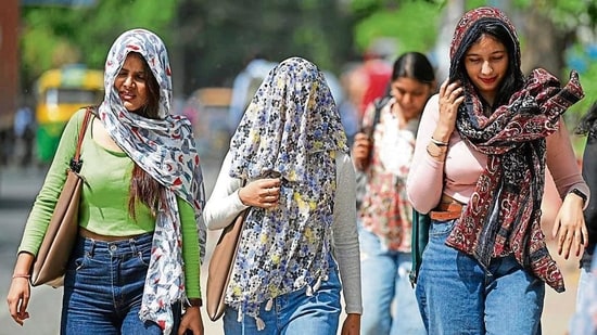 Students are walking into exam halls armed with protective gear and bottles of water-based drinks to battle the high temperature in Delhi. (Photo: Sanchit Khanna/HT (For representational purpose))