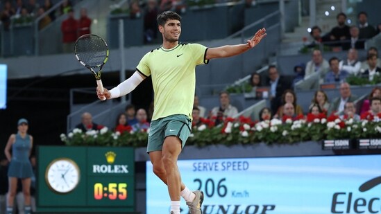 Spain's Carlos Alcaraz returns the ball to Russia's Andrey Rublev during the 2024 ATP Tour Madrid Open tournament quarter-final tennis match at Caja Magica in Madrid (AFP)