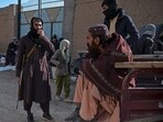 Taliban security personnel stand guard during the food distribution to Afghan people at Nawabad Kako Sahib area in Baraki Barak district. Taliban security personnel stand guard during the food distribution to Afghan people at Nawabad Kako Sahib area in Baraki Barak district.