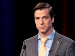 FILE - Libertarian Chase Oliver, candidate for Georgia's U.S. Senate seat, listens during a debate, Oct. 16, 2022, in Atlanta, Ga. The Libertarian Party on Sunday, May 26, 2024, nominated party activist Oliver for president