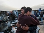 Palestinians react next to the destruction after an Israeli strike where displaced people were staying in Rafah, Gaza Strip. Palestinians react next to the destruction after an Israeli strike where displaced people were staying in Rafah, Gaza Strip.