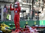 Ferrari's Monegasque driver Charles Leclerc celebrates after winning the Formula One Monaco Grand Prix 