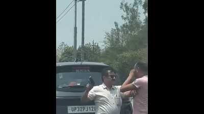 A screengrab from a video showing Vinod Mishra assaulting a taxi driver in Lucknow A screengrab from a video showing Vinod Mishra assaulting a taxi driver in Lucknow