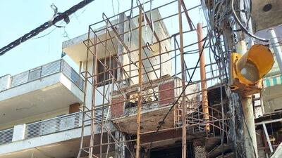 An MCD official said that owners of the building clearly seem to have covered the balcony and open section of the building with an iron frame and chrome panels. (HT Photo) An MCD official said that owners of the building clearly seem to have covered the balcony and open section of the building with an iron frame and chrome panels. (HT Photo)