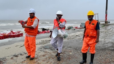 Volunteers of the Cyclone Preparedness Program (CPP) used a megaphone to urge people to evacuate as a precautionary measure in Kuakata on May 26, 2024, ahead of Cyclone Remal's landfall in Bangladesh. (AFP) Volunteers of the Cyclone Preparedness Program (CPP) used a megaphone to urge people to evacuate as a precautionary measure in Kuakata on May 26, 2024, ahead of Cyclone Remal's landfall in Bangladesh. (AFP)