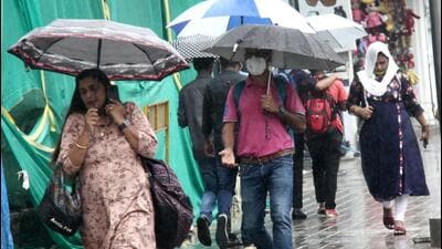 Bengaluru, India - October 6, 2021: People holding umbrellas at Brigade Road, following heavy rain in Bengaluru, Karnataka, India on on Wednesday, October 6, 2021. (Photo by Samuel Rajkumar/Hindustan Times) Bengaluru, India - October 6, 2021: People holding umbrellas at Brigade Road, following heavy rain in Bengaluru, Karnataka, India on on Wednesday, October 6, 2021. (Photo by Samuel Rajkumar/Hindustan Times)