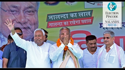 Bihar CM Nitish Kumar with JD(U) candidate Kaushalendra Kumar during a public meeting, in Nalanda on Monday. (ANI)