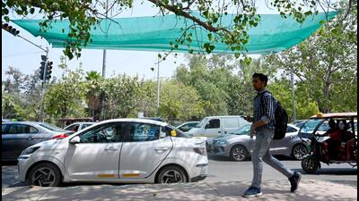 Daily commuters, however, say that the sunshade will provide only some respite from direct sunlight till the time they halt on the traffic junction. (Sunil Ghosh/HT Photo) Daily commuters, however, say that the sunshade will provide only some respite from direct sunlight till the time they halt on the traffic junction. (Sunil Ghosh/HT Photo)
