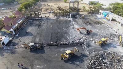 Debris being removed from the game zone site where a fire broke out on Saturday, in Rajkot on Monday. (PTI) Debris being removed from the game zone site where a fire broke out on Saturday, in Rajkot on Monday. (PTI)