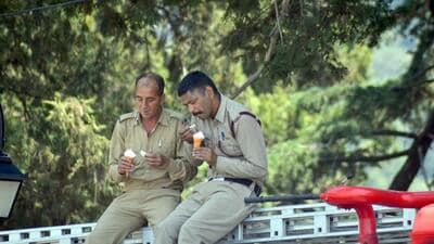 Firefighters enjoying ice cream during a break in Shimla, Himachal. (Deepak Sansta/HT) Firefighters enjoying ice cream during a break in Shimla, Himachal. (Deepak Sansta/HT)