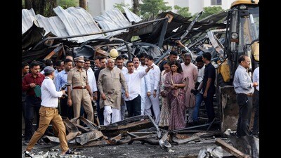Gujarat chief minister Bhupendra Patel inspects the fire accident site in Rajkot on Sunday. (AFP) Gujarat chief minister Bhupendra Patel inspects the fire accident site in Rajkot on Sunday. (AFP)