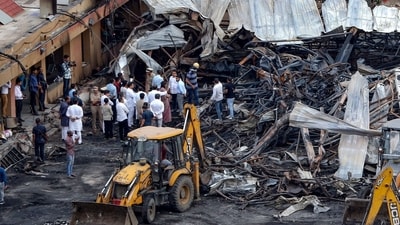 Officials inspect the site of a fire accident at a gaming zone in Rajkot on May 26, 2024. (AFP) Officials inspect the site of a fire accident at a gaming zone in Rajkot on May 26, 2024. (AFP)