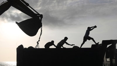 FILE- Workers use machinery at a coastal road project construction site in Mumbai, India, Aug. 26, 2021. (AP Photo/Rafiq Maqbool, File) (AP) FILE- Workers use machinery at a coastal road project construction site in Mumbai, India, Aug. 26, 2021. (AP Photo/Rafiq Maqbool, File) (AP)
