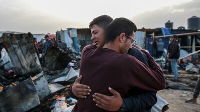 Palestinians react next to the destruction after an Israeli strike where displaced people were staying in Rafah, Gaza Strip. (AP) Palestinians react next to the destruction after an Israeli strike where displaced people were staying in Rafah, Gaza Strip. (AP)