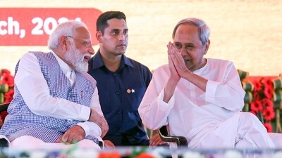 Prime Minister Narendra Modi with Odisha CM Naveen Patnaik in Chandikhole, Odisha recently. (ANI Photo)