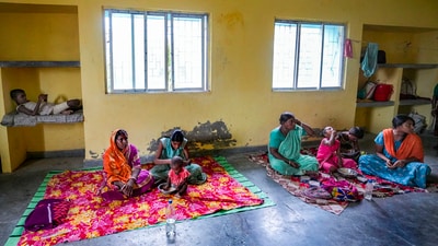 Locals seek shelter at a relief camp in Frazerganj of Namkhana ahead of Cyclone 'Remal' landfall in South 24 Parganas district on Sunday, May 26, 2024. (PTI) Locals seek shelter at a relief camp in Frazerganj of Namkhana ahead of Cyclone 'Remal' landfall in South 24 Parganas district on Sunday, May 26, 2024. (PTI)