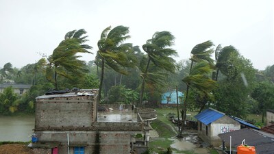 Rains and strong winds hit South 24 Parganas district ahead of Cyclone 'Remal' landfall on Sunday.. The cyclone caused significant disruption, including blown-away roofs of thatched huts, uprooted trees, and knocked-down electric poles. (PTI) Rains and strong winds hit South 24 Parganas district ahead of Cyclone 'Remal' landfall on Sunday.. The cyclone caused significant disruption, including blown-away roofs of thatched huts, uprooted trees, and knocked-down electric poles. (PTI)