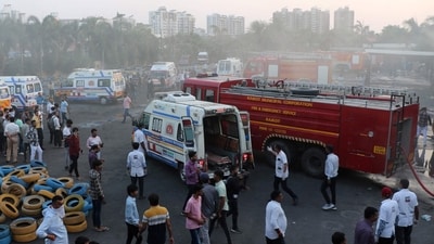 Ambulances and fire trucks are pictured near the site after a fire broke out at an amusement park facility in Rajkot on May 25. (AFP) Ambulances and fire trucks are pictured near the site after a fire broke out at an amusement park facility in Rajkot on May 25. (AFP)