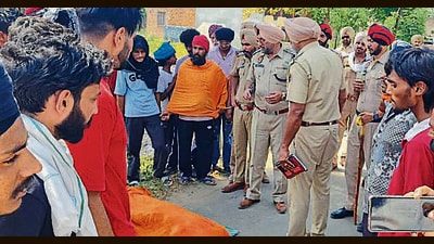 The police at the crime spot at Rajoana village on Monday. (HT Photo) The police at the crime spot at Rajoana village on Monday. (HT Photo)