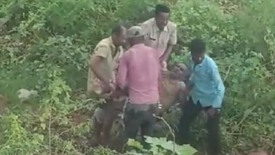 Karnataka man gets stuck inside a muddy land, police rescue. VIDEO Karnataka man gets stuck inside a muddy land, police rescue. VIDEO