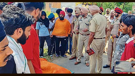 The police at the crime spot at Rajoana village on Monday. (HT Photo)