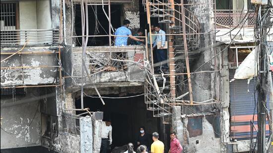 The site of fire at Vivek Vihar, on Monday. (Arvind Yadav/HT Photo)
