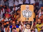 Stock market after Lok Sabha elections: A child holds a placard depicting PM Modi and BJP election symbol during a public meeting addressed by Uttar Pradesh Chief Minister Yogi Adityanath for Lok Sabha polls, in Varanasi. Stock market after Lok Sabha elections: A child holds a placard depicting PM Modi and BJP election symbol during a public meeting addressed by Uttar Pradesh Chief Minister Yogi Adityanath for Lok Sabha polls, in Varanasi.
