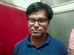 Dhaval Thakkar, the main accused in the Rajkot TRP game zone fire incident, after he was arrested by the Rajkot police and Banaskantha Local Crime Branch police from Abu Road in Rajasthan. Dhaval Thakkar, the main accused in the Rajkot TRP game zone fire incident, after he was arrested by the Rajkot police and Banaskantha Local Crime Branch police from Abu Road in Rajasthan.