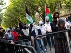 Demonstrators from the pro-Palestine encampment on Columbia's Campus barricade themselves inside Hamilton Hall, where the office of the Dean is located in New York City.(Photo by Alex Kent / GETTY IMAGES NORTH AMERICA / Getty Images via AFP)