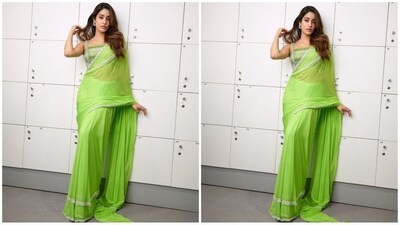 Her saree comes in a captivating shade of green and features a striking silver sequin border all over adding a glam touch. She draped it elegantly around her with letting the pallu beautifully fall from the shoulders. (Instagram/@stylebyami) Her saree comes in a captivating shade of green and features a striking silver sequin border all over adding a glam touch. She draped it elegantly around her with letting the pallu beautifully fall from the shoulders. (Instagram/@stylebyami)