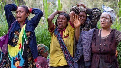 Villagers react as they search through a landslide in Yambali village, in the Highlands of Papua New Guinea, Monday, May 27, 2024. ((Juho Valta/UNDP Papua New Guinea via AP)) Villagers react as they search through a landslide in Yambali village, in the Highlands of Papua New Guinea, Monday, May 27, 2024. ((Juho Valta/UNDP Papua New Guinea via AP))