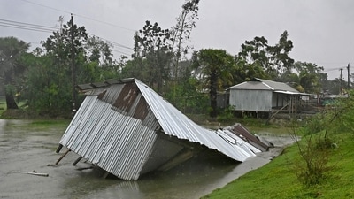 A damaged house is seen during rainfall in Patuakhali following the landfall of Cyclone Remal in Bangladesh. (AFP) A damaged house is seen during rainfall in Patuakhali following the landfall of Cyclone Remal in Bangladesh. (AFP)