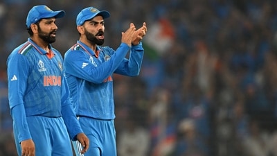 India's captain Rohit Sharma (L) and teammate Virat Kohli celebrate after the dismissal of Australia's Mitchell Marsh (AFP) India's captain Rohit Sharma (L) and teammate Virat Kohli celebrate after the dismissal of Australia's Mitchell Marsh (AFP)