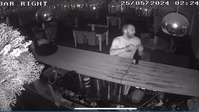 The image shows a thief helping himself to a drink while robbing a pub. (Facebook/@The Inn At Belfairs) The image shows a thief helping himself to a drink while robbing a pub. (Facebook/@The Inn At Belfairs)