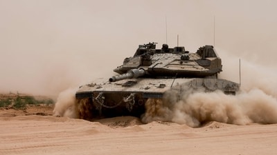 An Israeli army tank rolls along Israel's southern border with the Gaza Strip on May 28, 2024, amid the ongoing conflict between Israel and the militant group Hamas. (AFP) An Israeli army tank rolls along Israel's southern border with the Gaza Strip on May 28, 2024, amid the ongoing conflict between Israel and the militant group Hamas. (AFP)