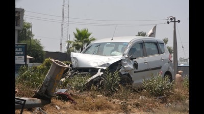 Mangled remains of the car and two-wheeler. (Sant Arora  /HT)
