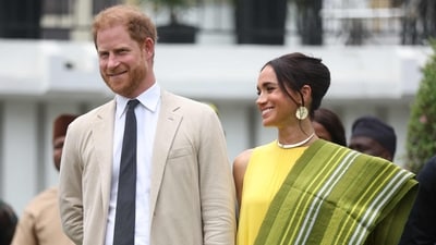 Prince Harry and Meghan Markle blasted for ‘taking advantage’ while royals are unable to conduct overseas tours (Photo by Kola SULAIMON / AFP) (AFP) Prince Harry and Meghan Markle blasted for ‘taking advantage’ while royals are unable to conduct overseas tours (Photo by Kola SULAIMON / AFP) (AFP)