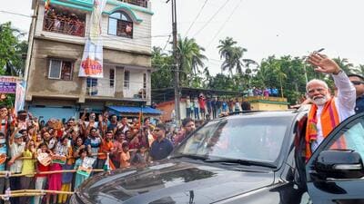 Prime Minister Narendra Modi holds a roadshow in West Bengal’s Barasat on Tuesday. (BJP media) Prime Minister Narendra Modi holds a roadshow in West Bengal’s Barasat on Tuesday. (BJP media)
