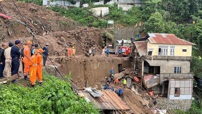 Rescue teams look for survivors amidst the debris next to a stone quarry that collapsed following torrential rains brought by Cyclone Remal on the outskirts of Mizoram’s capital Aizawl on Tuesday. (REUTERS)