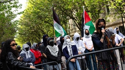 Demonstrators from the pro-Palestine encampment on Columbia's Campus barricade themselves inside Hamilton Hall, where the office of the Dean is located in New York City.(Photo by Alex Kent / GETTY IMAGES NORTH AMERICA / Getty Images via AFP) (Getty Images via AFP)