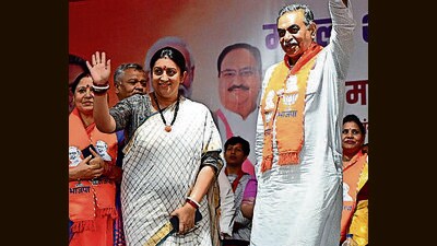 Union minister Smriti Irani with BJP pick Sanjay Tandon at a party event in Ram Darbar, Chandigarh, on Tuesday. (Keshav Singh/HT) Union minister Smriti Irani with BJP pick Sanjay Tandon at a party event in Ram Darbar, Chandigarh, on Tuesday. (Keshav Singh/HT)
