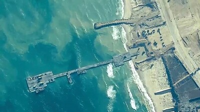 A US-built temporary pier that had been used to deliver additional humanitarian aid into Gaza was damaged by rough seas and has temporarily suspended operations. (AP) A US-built temporary pier that had been used to deliver additional humanitarian aid into Gaza was damaged by rough seas and has temporarily suspended operations. (AP)