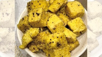 1. Khaman Dhokla - 150 kcal per serving: Combine besan, sooji, baking soda, salt, sugar, lemon juice, and water to form a smooth batter. Pour into a greased steaming pan and steam for 15-20 minutes. Temper with mustard seeds and curry leaves. It’s steamed, light and fluffy, with a tangy flavour profile. 1. Khaman Dhokla - 150 kcal per serving: Combine besan, sooji, baking soda, salt, sugar, lemon juice, and water to form a smooth batter. Pour into a greased steaming pan and steam for 15-20 minutes. Temper with mustard seeds and curry leaves. It’s steamed, light and fluffy, with a tangy flavour profile. 