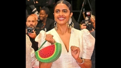Kani Kusruti's watermelon clutch on the Cannes 2024 red carpet combines glamour and a powerful political statement. (Instagram) Kani Kusruti's watermelon clutch on the Cannes 2024 red carpet combines glamour and a powerful political statement. (Instagram)