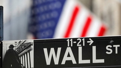 A street sign for Wall Street is seen outside the New York Stock Exchange (NYSE) in New York City, New York. (Reuters)