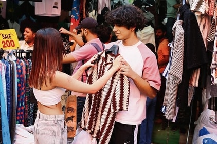 Neel Chatterjee, a college student, gives in to the demands of his girlfriend while scouting for options at shop 118. (Photo: Manoj Verma/HT) Neel Chatterjee, a college student, gives in to the demands of his girlfriend while scouting for options at shop 118. (Photo: Manoj Verma/HT)