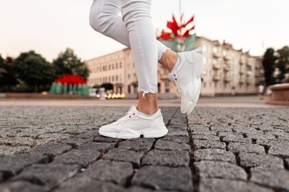 White sneakers pay a complete ode to summer (Shutterstock) White sneakers pay a complete ode to summer (Shutterstock)