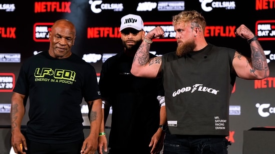 Mike Tyson, left, and Jake Paul, right, pose for photos during a news conference promoting their upcoming boxing bout, Thursday, May 16, 2024, in Arlington, Texas. The fight is schedule for July 20. (AP Photo/Sam Hodde) (AP)